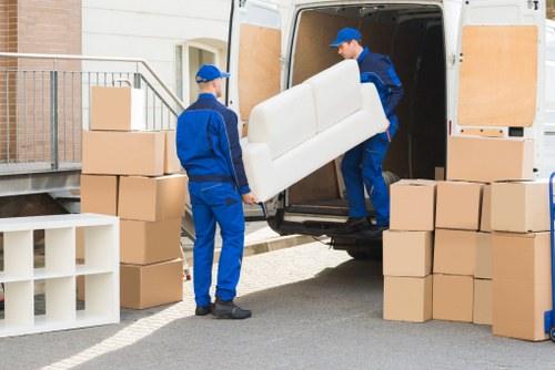 Removal team handling household items carefully