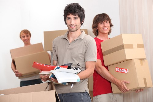 Packed moving boxes and furniture ready for transport