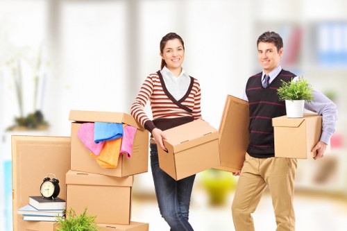 Local Edgware movers organising labelled boxes during a packing service