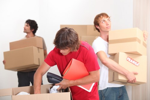 Professional movers loading furniture for an Edgware home move