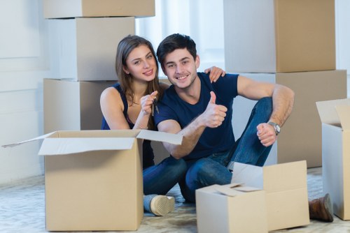 Packed moving boxes and furniture ready for house removal in Edgware