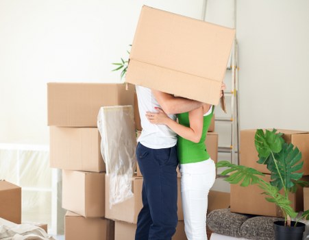 Unpacking assistance in Edgware helping arrange boxes in a new home