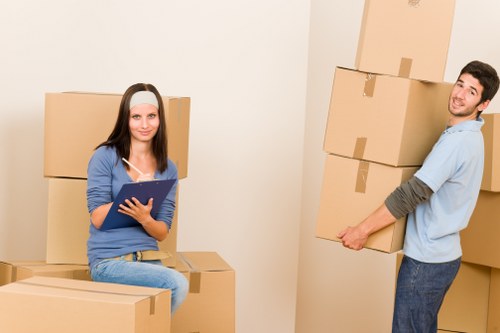 Commercial movers preparing office equipment for transport in Edgware